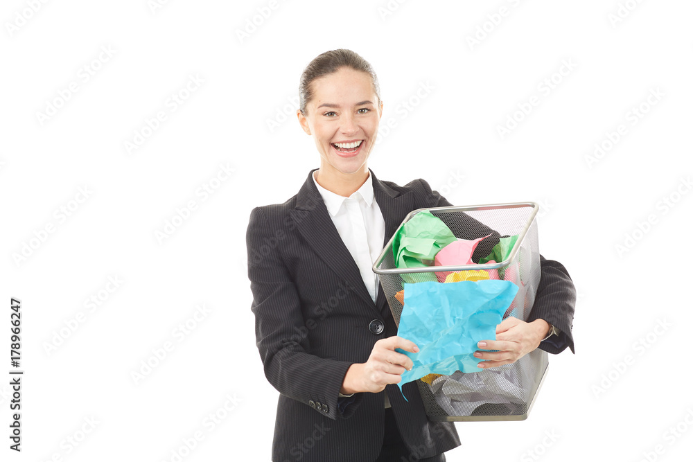 Portrait of female office worker holding basket with crumpled papers Portrait of female office worker holding basket with crumpled papers