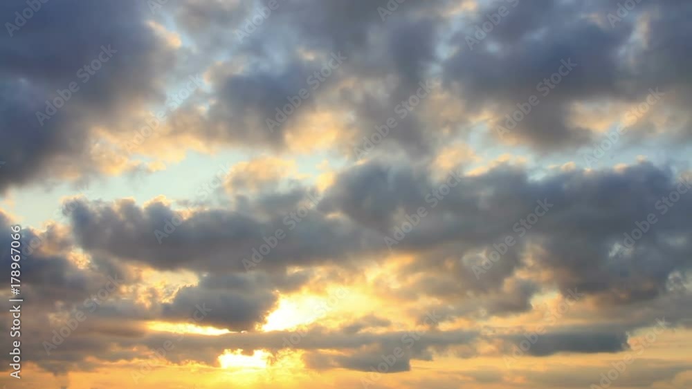 Beautiful cloudscape during warm sunset time. Timelapse. Beams of sunshine filter through clouds at sunset. Beautiful cloudscape during warm sunset time. Timelapse. Beams of sunshine filter through clouds at sunset.