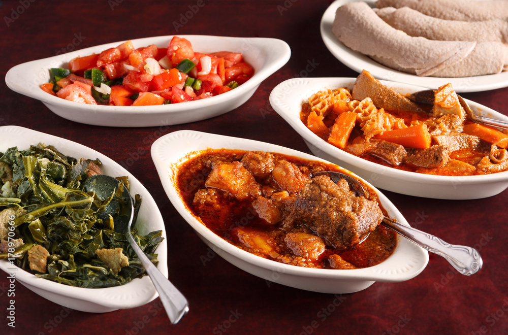 Variety of Authentic Ethiopian Dishes with Injera Bread Variety of Authentic Ethiopian Dishes with Injera Bread