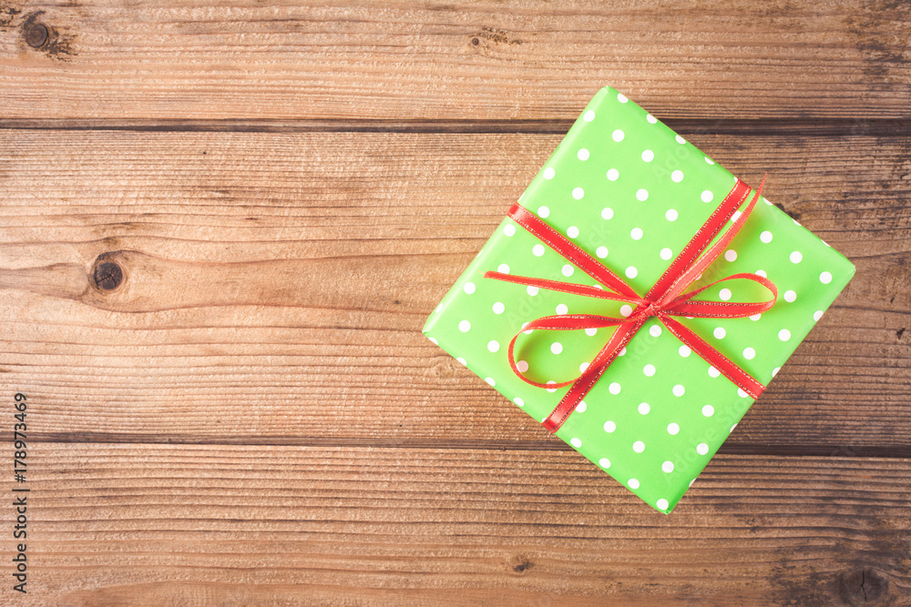 Gift on wooden table. Christmas background. top view Gift on wooden table. Christmas background. top view