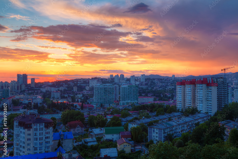 Aerial view of the Sochi city on the background of beautiful sky at sunset, Russia

