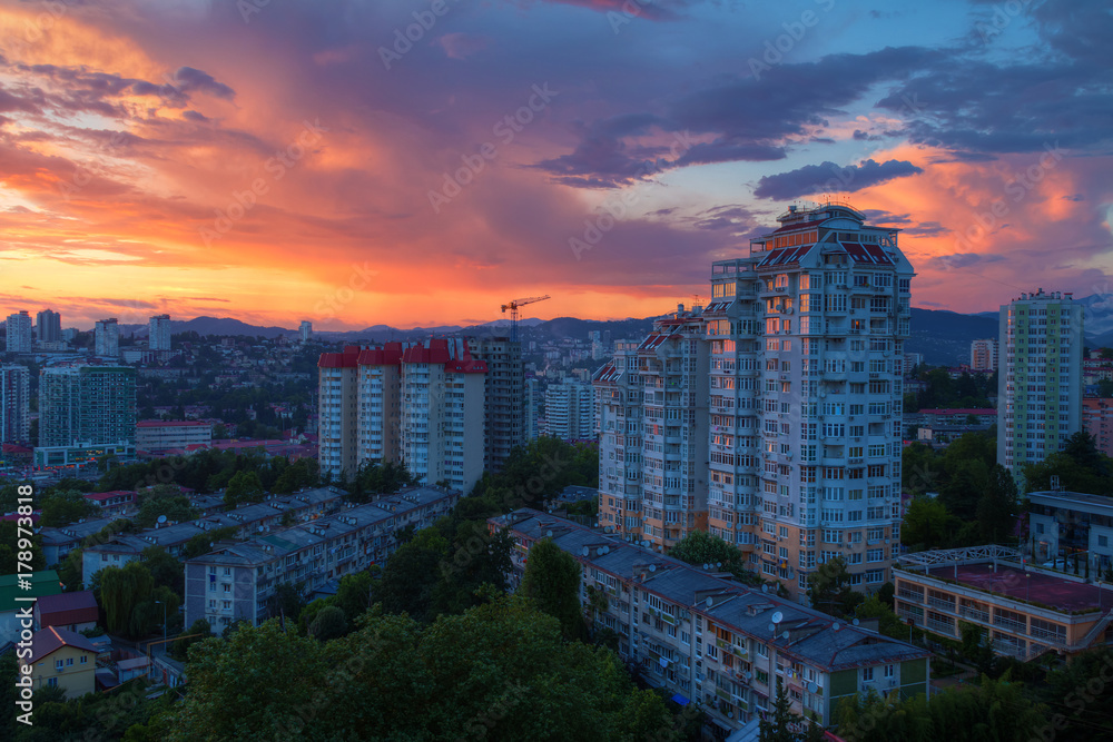 Obraz premium Aerial view of the Sochi city on the background of beautiful sky at sunset, Russia 