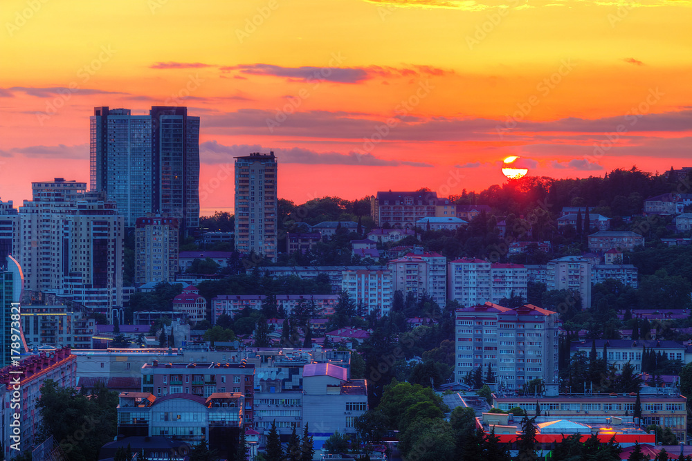 Obraz premium Aerial view of the Sochi city on the background of the setting sun and beautiful sky, Russia 