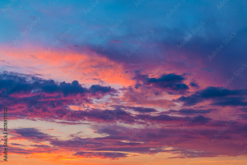 Beautiful cloudscape with colorful contrasting clouds at sunset
