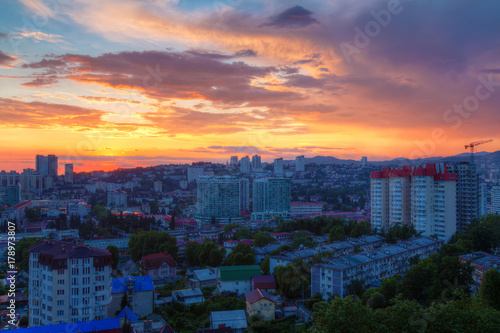 Aerial view of the Sochi city on the background of beautiful sky at sunset, Russia 