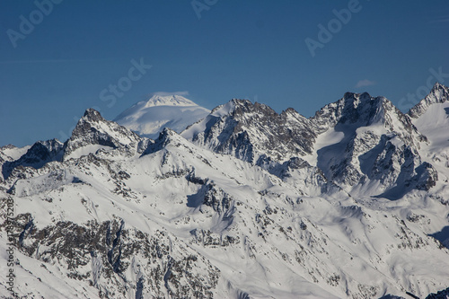 Winter mountains and peaks on a clear day.
