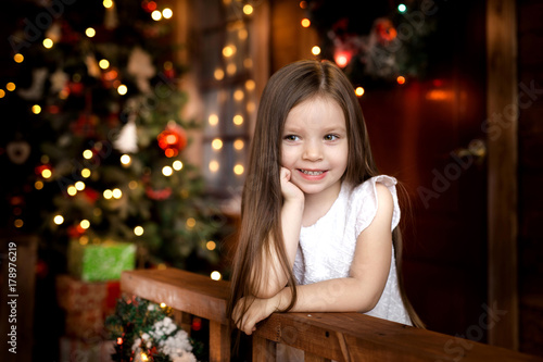 On Christmas night a little girl waiting for Santa Claus.