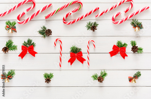 Christmas background with candies and small balls on wood