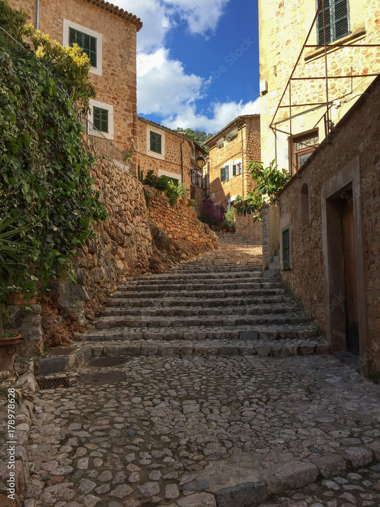 Romantic street in the picturesque small town Fornalutx, Majorca Spain