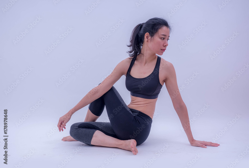 Beautiful young Asian doing yoga exercise isolated on white background. Healthy lifestyle and good wellness concepts Beautiful young Asian doing yoga exercise isolated on white background. Healthy lifestyle and good wellness concepts