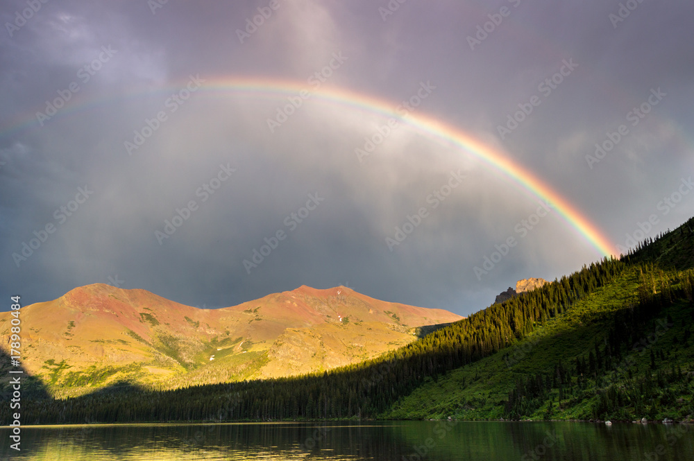 Rainbow over Lower Two Medicine lake at Glacier national park, Montana, United States