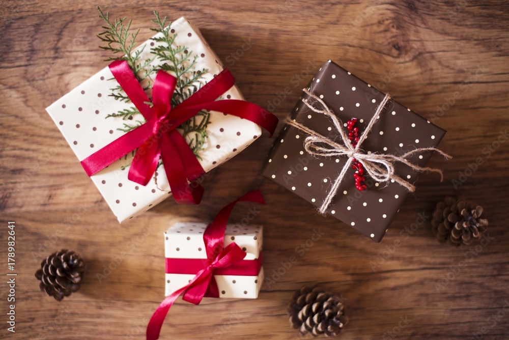 christmas gifts on wooden background christmas gifts on wooden background