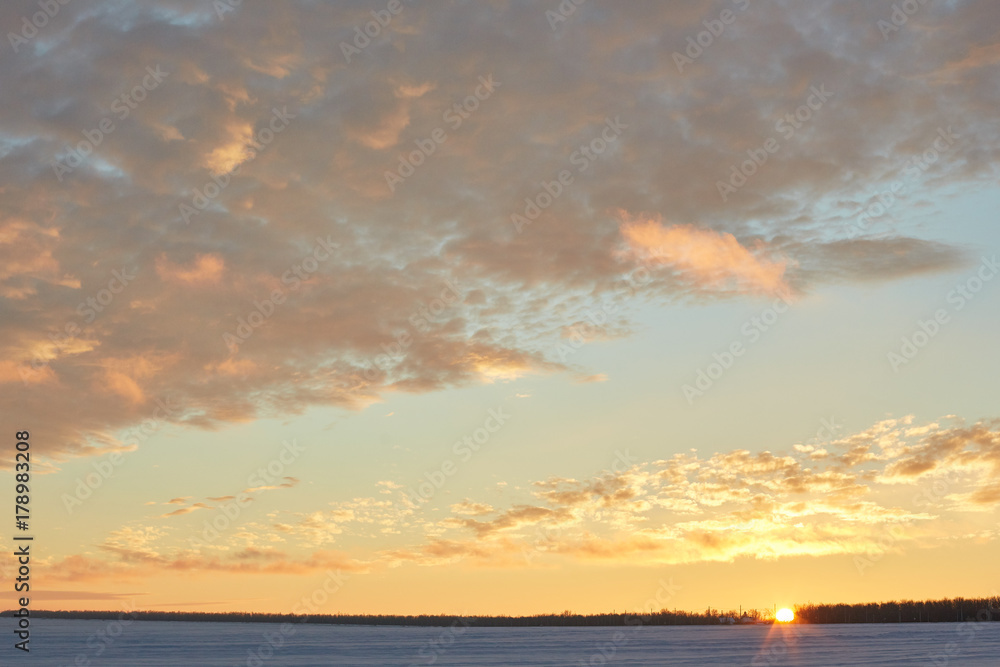 beautiful sunset in winter. Snow, frost, clouds