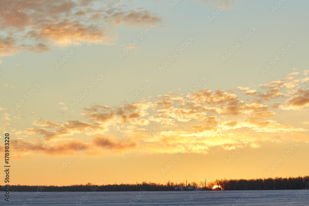Fototapeta premium beautiful sunset in winter. Snow, frost, clouds