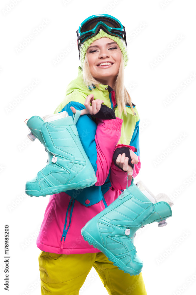 beautiful young blonde woman in colorful snow coat hold snow boots beautiful young blonde woman in colorful snow coat hold snow boots