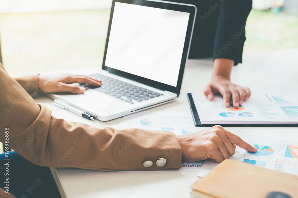 Business concept. Business people discussing the charts and graphs showing the results of their successful teamwork. Business concept. Business people discussing the charts and graphs showing the results of their successful teamwork.