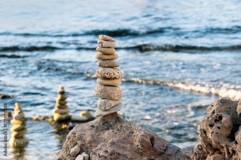 stone stack at coast with blue sea stone stack at coast with blue sea