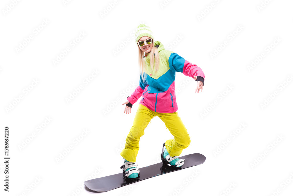 Fototapeta premium beauty young woman in ski suit and sunglasses ride snowboard