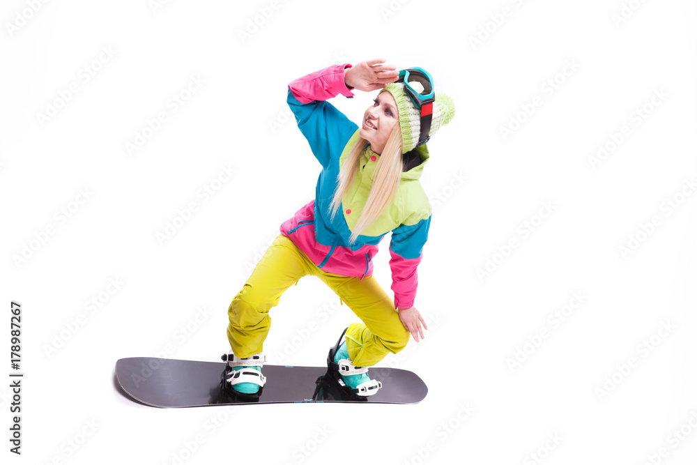 beauty young woman in ski suit and ski glasses ride snowboard