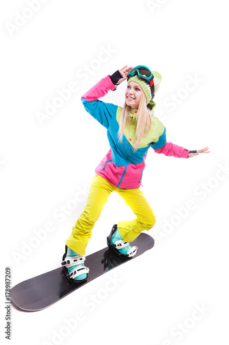 beauty young woman in ski suit and ski glasses ride snowboard