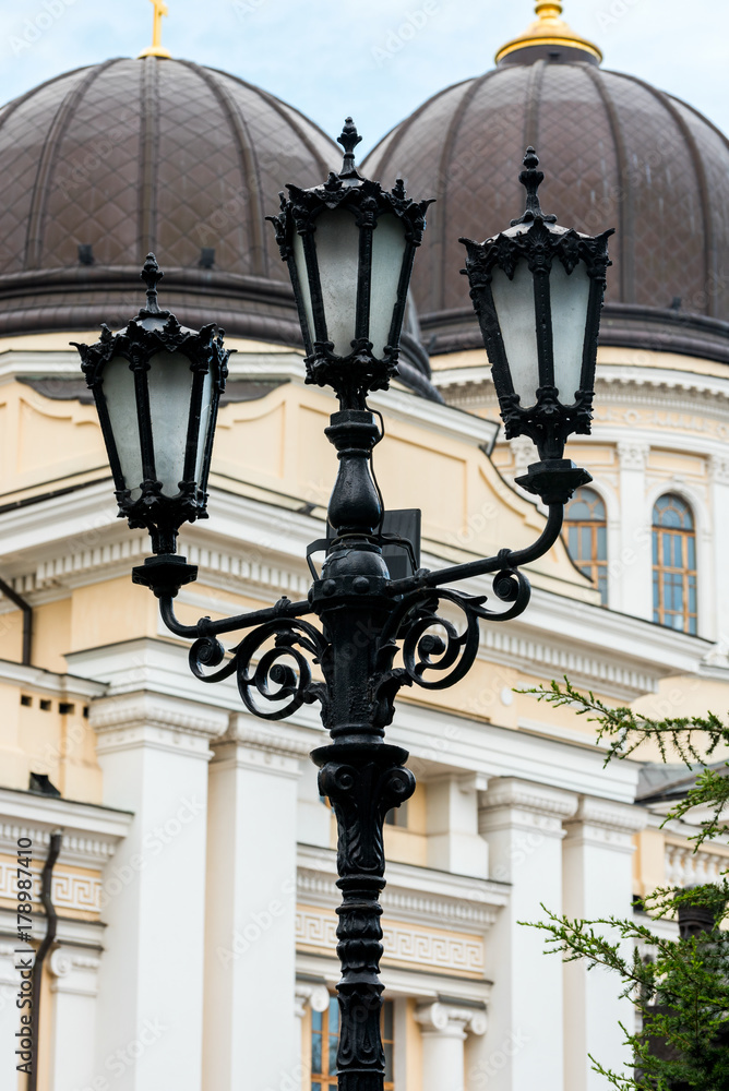 old street lamp on the background of the cathedral building in Odessa, Ukraine old street lamp on the background of the cathedral building in Odessa, Ukraine