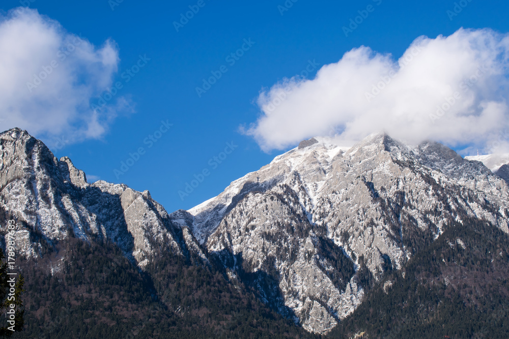 Caraiman mountain, Caraiman cross covered by clouds, Bucegi, Romania