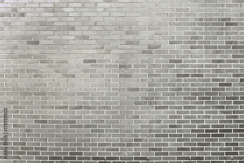 Old grey brick wall background texture