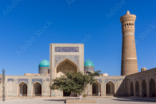 Courtyard at Po-i-Kalyan, with the madrasa and minaret - Bukhara, Uzbekistan. The complex include Kalyan four-iwan mosque and Kalyan minaret. photo