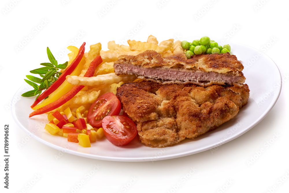 Wiener schnitzel with potatoes fries, isolated on white background