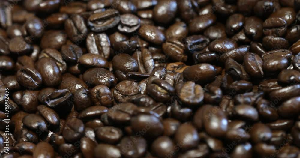 Roasted brown coffee beans, can be used as a background. 4k video. Roasted brown coffee beans, can be used as a background. 4k video.