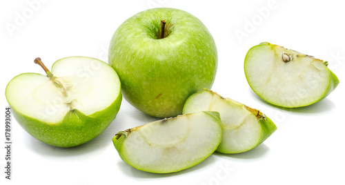 One whole apple Granny Smith, two slices and one half, isolated on white background 