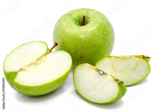 One whole apple Granny Smith, three slices and one half, isolated on white background 
