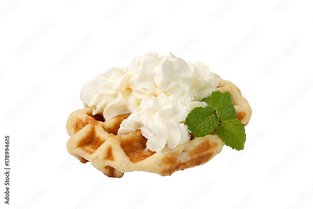 Belgian waffle topped with whipped cream