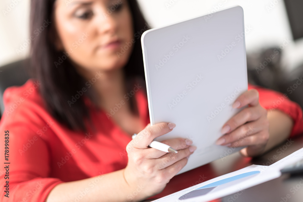 Young attractive businesswoman using a tablet Young attractive businesswoman using a tablet