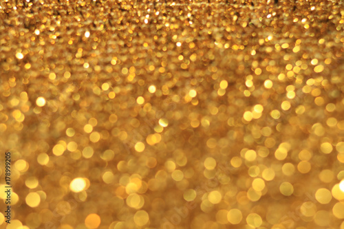 Yellow and gold bokeh abstract glitter background