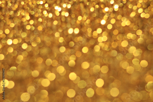 Gold bokeh glitter abstract light background 