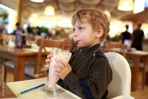 Kid has milkshake