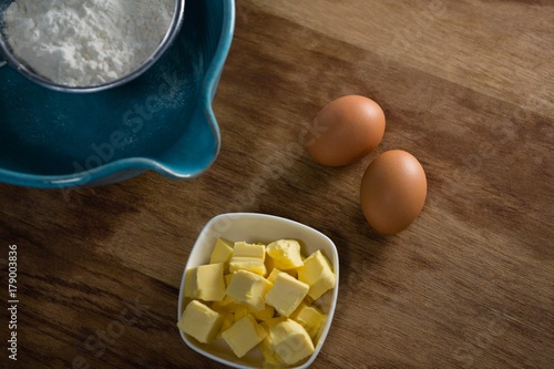 Flour in stainer with eggs and cheese photo