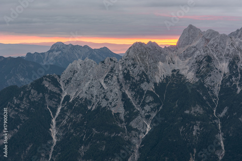 Spectacular sunrise line behind a mountain ridge. © anzebizjan