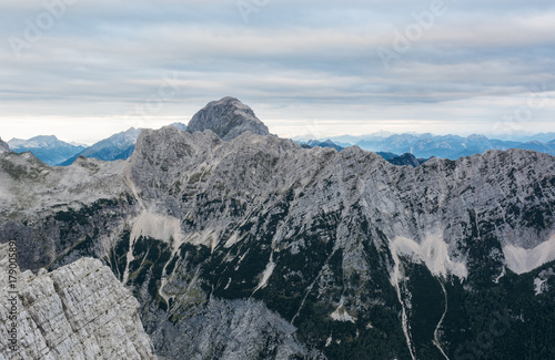 Mountain landscape of sheer ridge above valley.