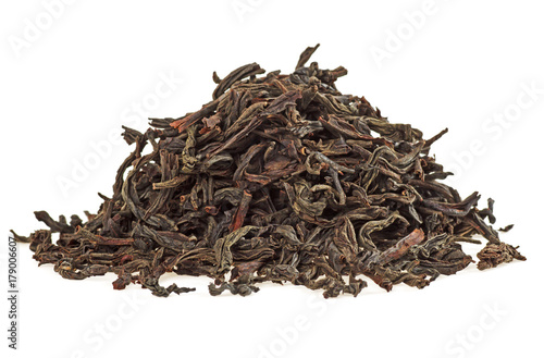 Dry tea leaves isolated on a white background, close up