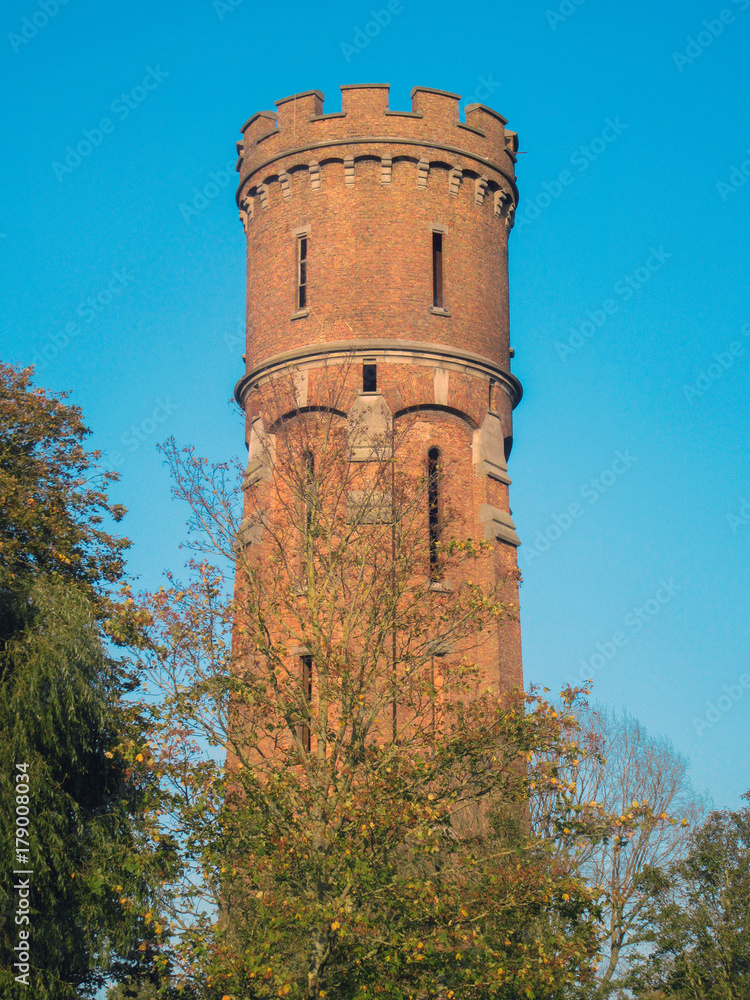 Obraz premium Medieval tower in Belgium. District of Flanders, near Bruges