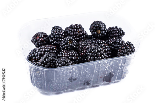 BlackBerry isolated on white in a plastic plate