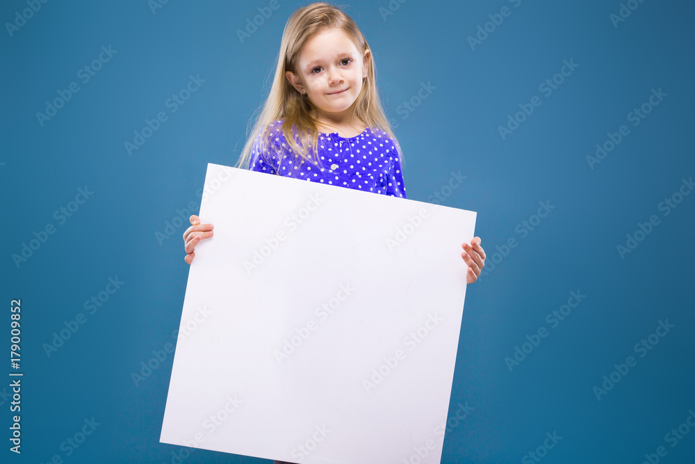 Cute little girl in purple dress holds empty poster Cute little girl in purple dress holds empty poster