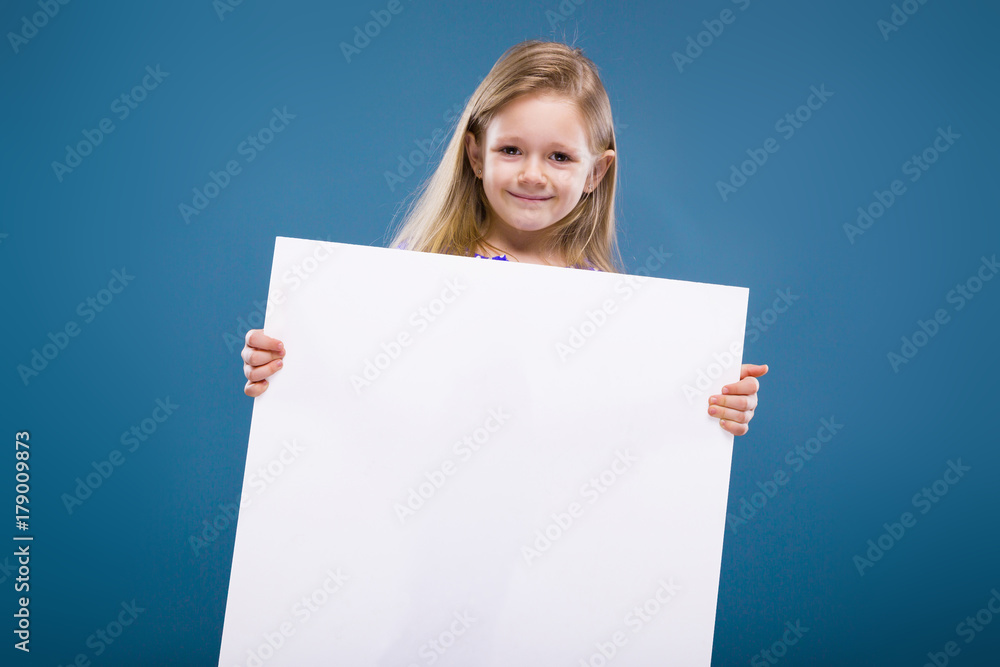 Cute little girl in purple dress holds empty poster Cute little girl in purple dress holds empty poster