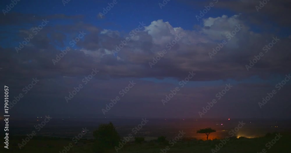 Night timelapse of tourist safari vans in the vast landscape of Maasai Mara National Park. Kenya, Africa Night timelapse of tourist safari vans in the vast landscape of Maasai Mara National Park. Kenya, Africa