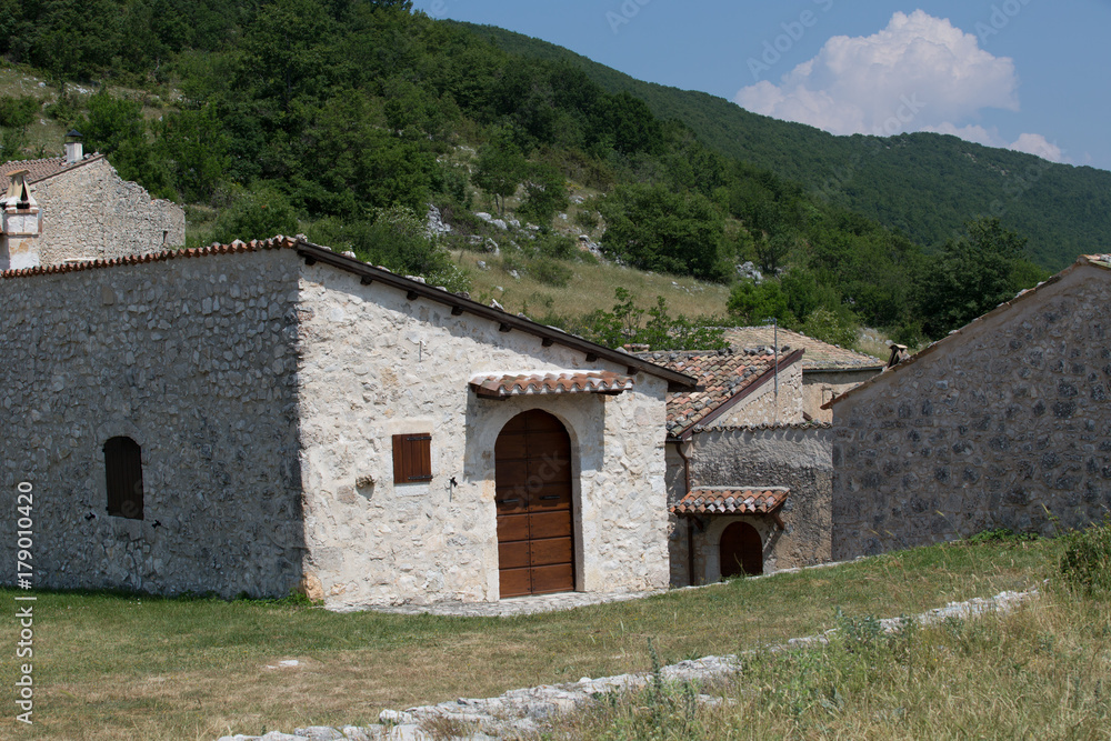 Ancient restored houses in an abandoned mountain village, Central Italy 