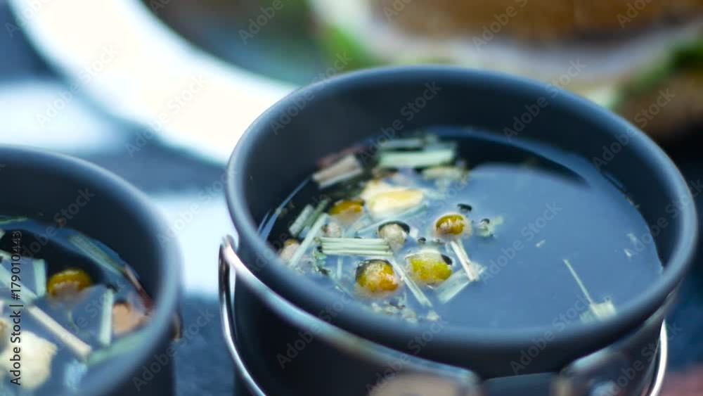 Hot herbal tea in a teacup. Hot herbal tea in a teacup.