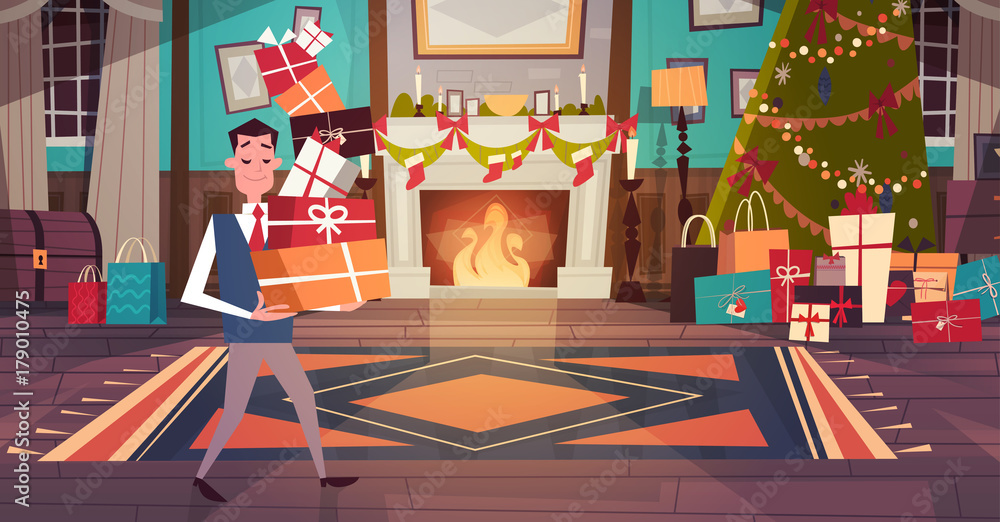 Φωτογραφία Man Holding Pile Of Gift Boxes In Living Room Decorated For Merry Christmas And