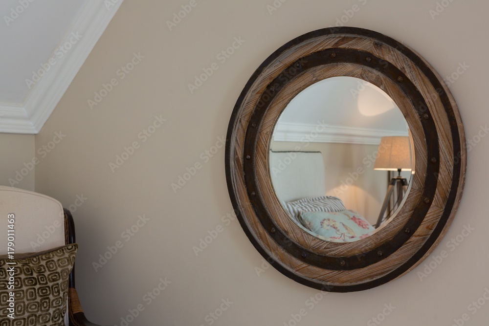 Fotografie Wooden framed mirror on wall